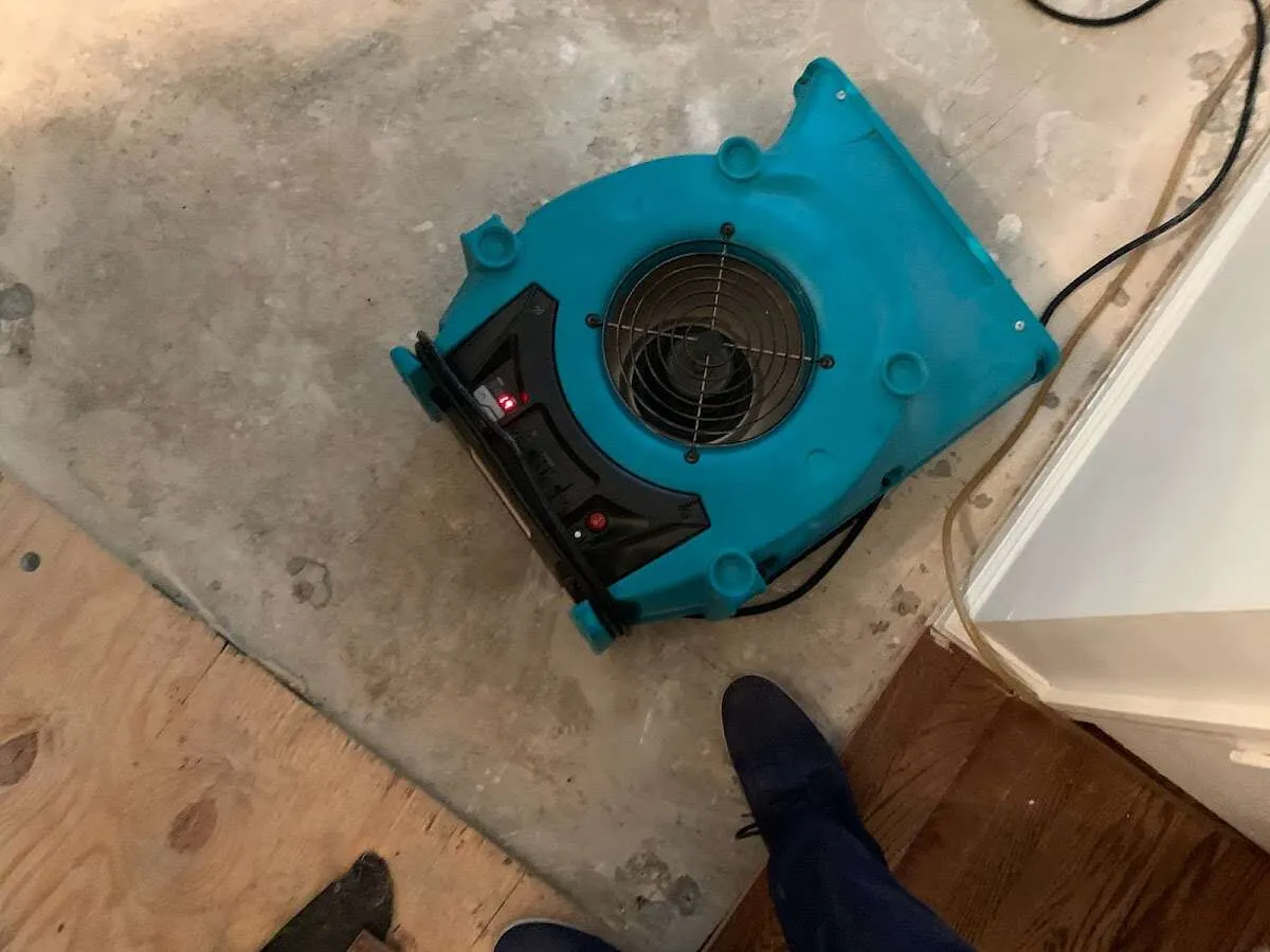 Air mover drying subfloor during Commercial Water Damage Restoration in Sleepy Hollow